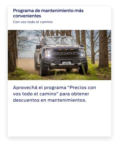 Perfil izquierdo de la camioneta F-150 Raptor blanca en la arena